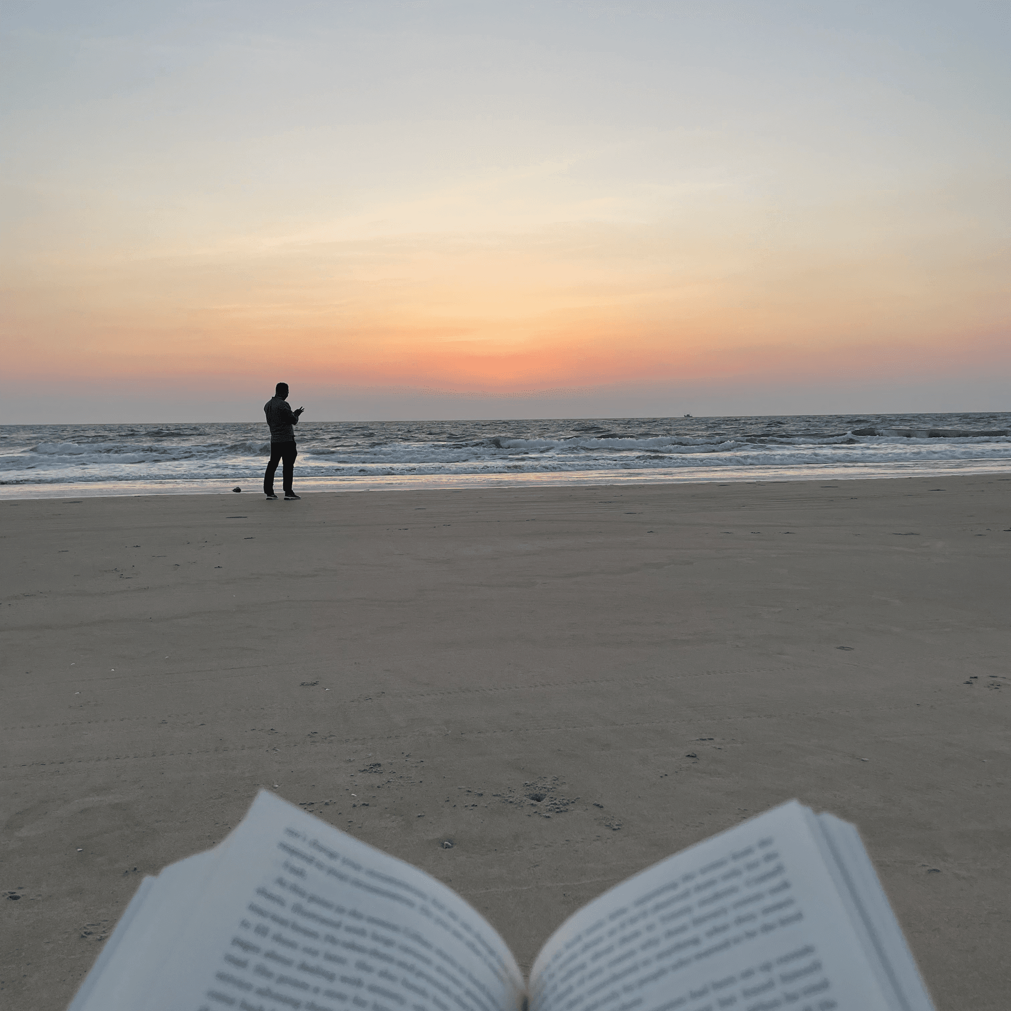 Reading a book on the beach at sunset, a few steps from the villa