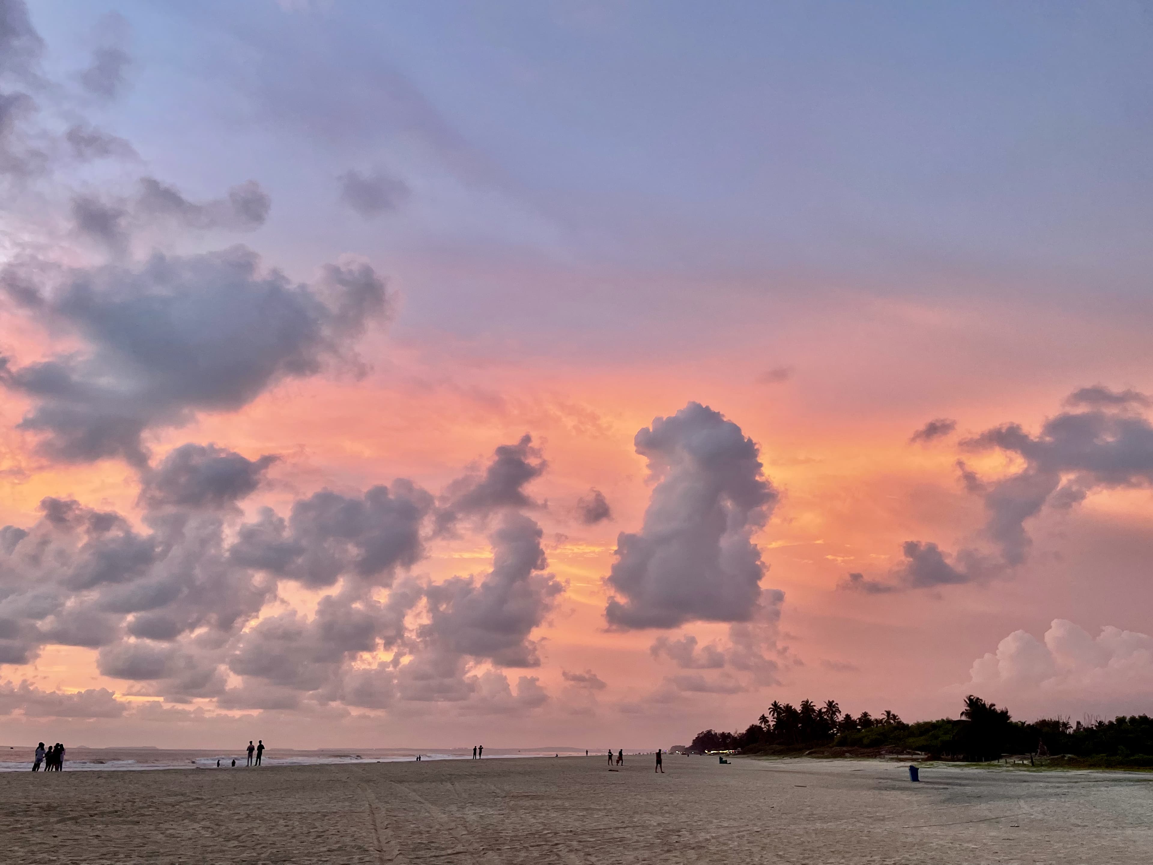 A pink and orange sunset over the beach