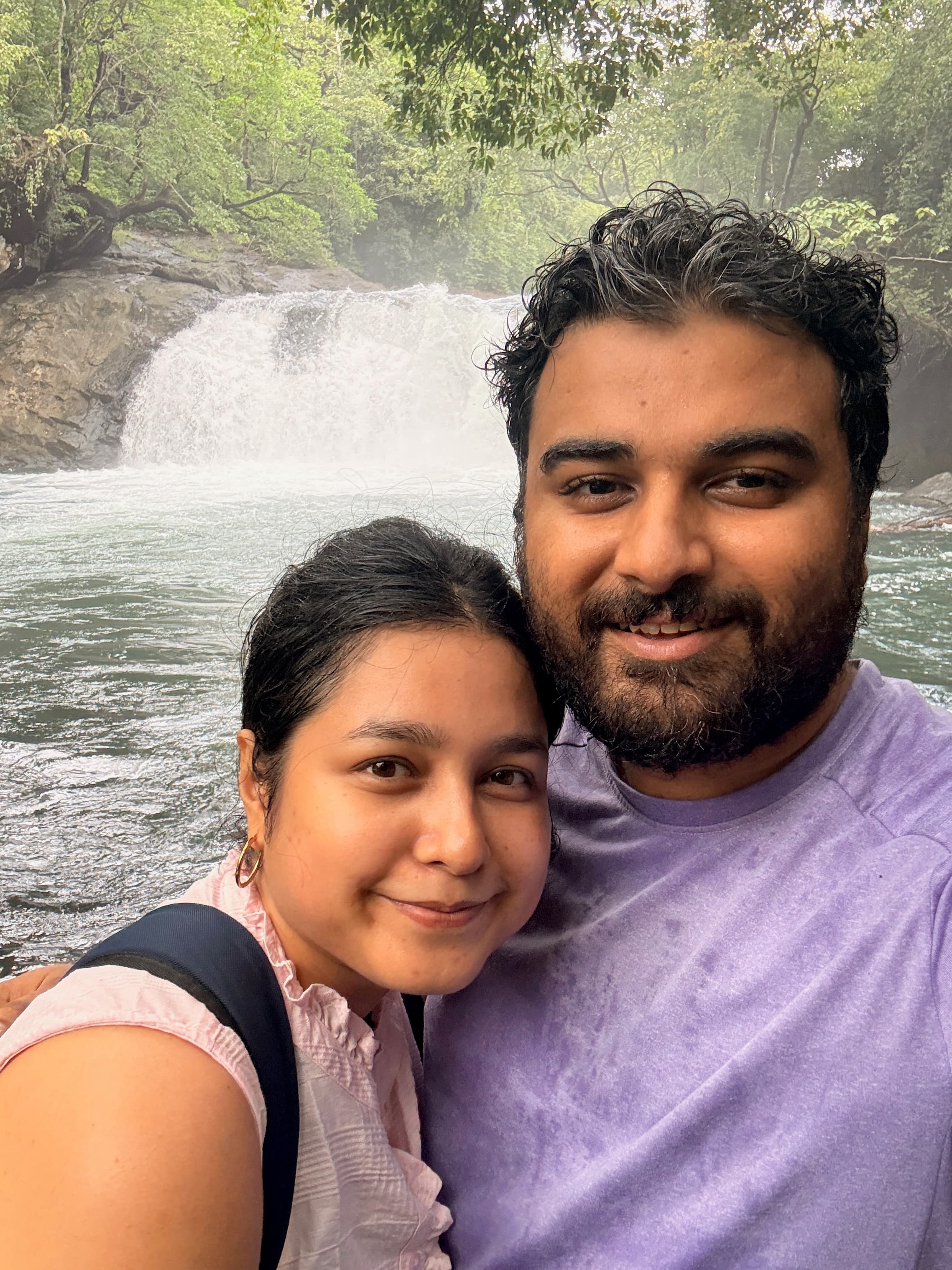 Sanchita and Garvit at a waterfall near Goa